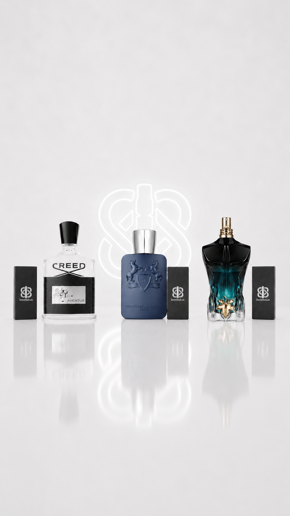 Perfume bottles next to Scentstick decant boxes
